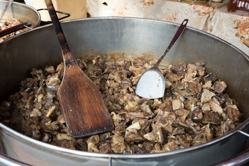 Jumari, delicious unhealthy fried pork greaves in a basket for sale during street food festival