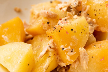 Potatoes and tuna in a white dish