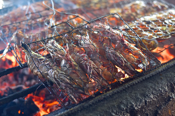 Barbecued shrimp being cooked in a fish market in Bali