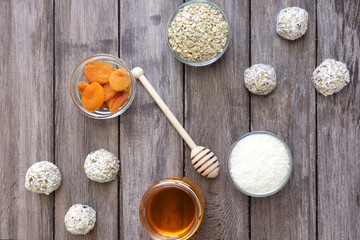 Protein balls or energy balls on a wooden background, healthy food for people on a diet, horizontal orientation, flat lay