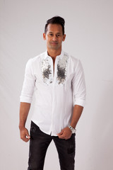 Fototapeta premium Happy man in a white shirt and a smile