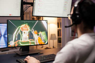 Competition of online shooter game played by professional gamer on power computer.