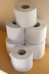 Stack of toilet paper, made with recycled paper. Selective focus.