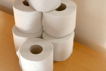 Stack of toilet paper, made with recycled paper. Selective focus.