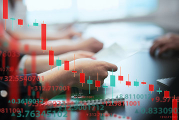 A group of people analyze the stock market. Business and finance, technology, cryptocurrency, stock...