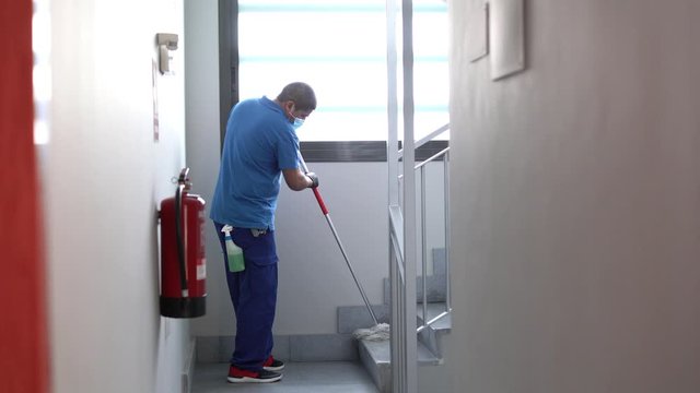 cleaning staff disinfecting to avoid the spread of covid19