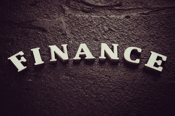Fototapeta premium Finance concept. The finance word on black background