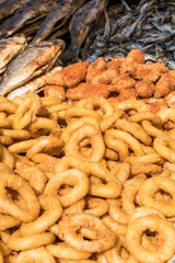 Freshly grilled fish on counter top stall, during seafood festival, street food market.