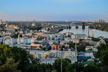 Landscape of Kiev city, Ukraine, Podil district, view of the Dnieper river in the sunset light on a summer day