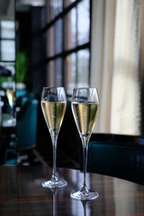 Two glasses of sparkling wine served on a luxury restaurant