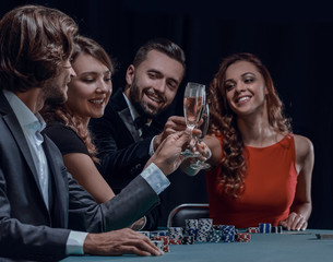 friends drinking and celebrating a gambling night