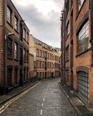 Typical street in East London with Victorian warehouses converted into luxury apartments