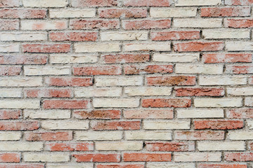 Brown color brick wall texture with checkerboard appearance with textured designs