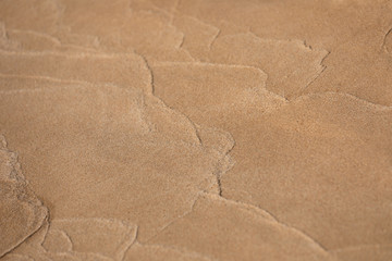 Fototapeta na wymiar Sand patterns and textures on the beach of Phu Quoc Island