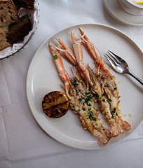Delicious lunch with grilled langoustines in a luxury restaurant