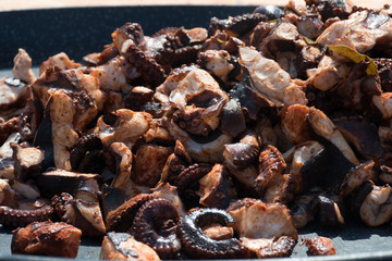Octopus small chopped bites, street food festival. Seafood festival.
