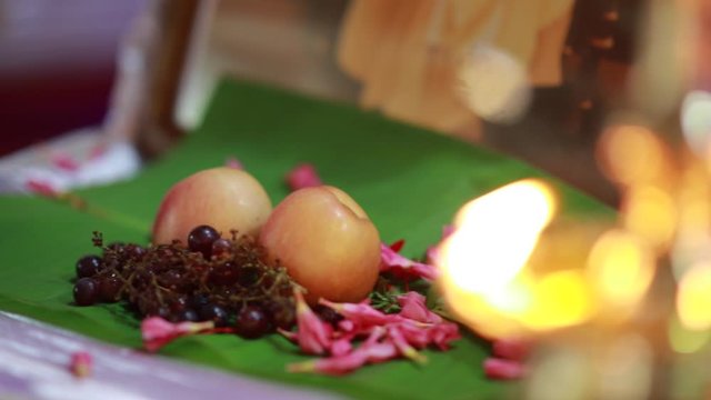 Traditional south Indian brass oil lamp 'Nilavilakku '. During events like housewarming, marriage etc., the Nilavilakku is lighted before starting the rituals. This video is taken during a wedding