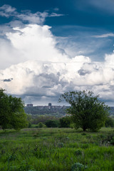sky after rain with huge clouds. city skyline.