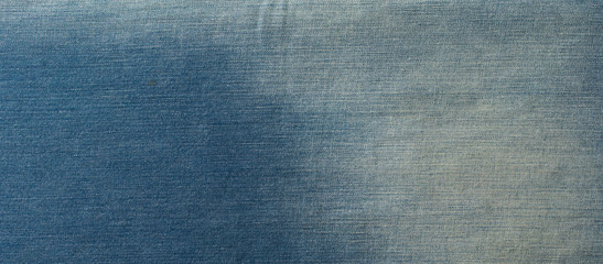 Blue denim jeans texture banner with copy space for text design background. Canvas denim fashion texture. Panoramic fashion banner