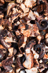 Octopus small chopped bites, street food festival. Seafood festival.