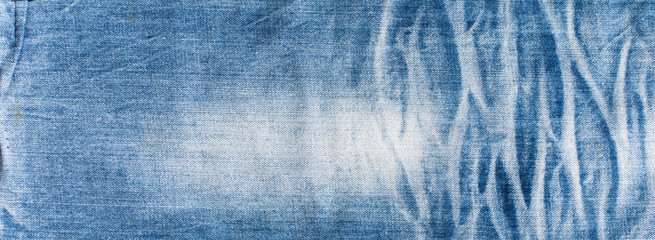 Blue denim jeans texture banner with copy space for text design background. Canvas denim fashion texture. Panoramic fashion banner