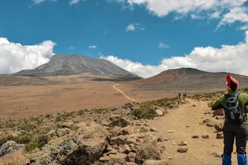 Fototapeta na wymiar A young woman against the background of Mount Kilimanjaro, Tanzania