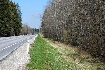 Car rides on the highway.