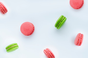 Colorful macaron cookies on white background.