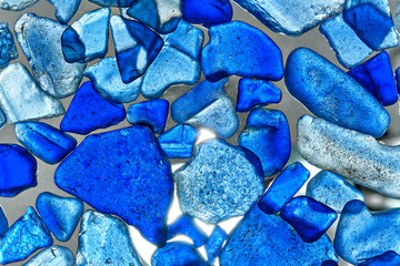 glass pieces polished by the sea isolated on transparent background. Abstract pattern with colored sea glass.