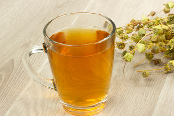 Dried sage. Hot drink sage in glass.