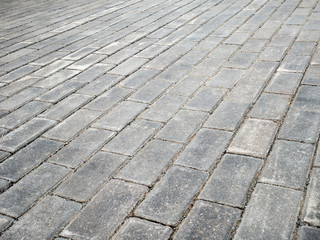 Paving slabs close up in the perspective diagonally, the texture.