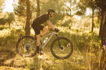 Fototapeta na wymiar Cyclist man riding mountain bike on a mountain.