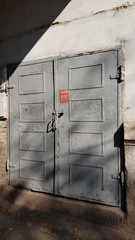 old metal door. Entrance to old grunge door of abandoned building in European city Odessa of Ukraine