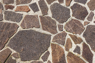 Close-up of an outdoor flooring made with irregular porphyry slabs, full frame, Italy, Europe - obrazy, fototapety, plakaty