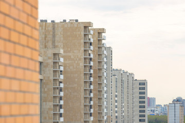 Fototapeta na wymiar View of modern multi-story reinforced concrete houses 