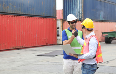 Engineering group working and they are loading container for support logistics and import export business