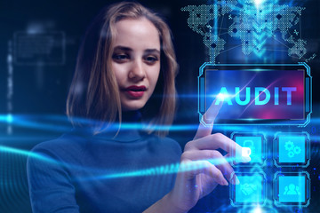 Business, Technology, Internet and network concept. Young businessman working on a virtual screen of the future and sees the inscription: Audit
