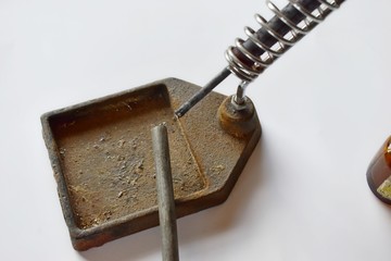 Soldering station and solder on a white background