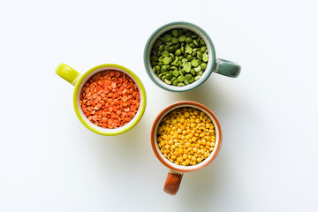 lentils of different types and colors in portioned cups. vegan proteins.