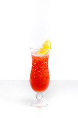 Red cocktail in a glass on a white background