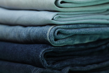 stack of blue jeans