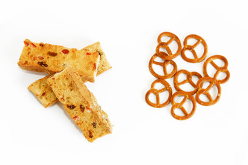 pieces of crackers and dried snacks bagels on a white background