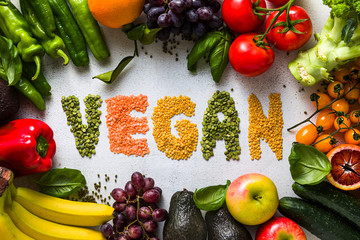 Fresh vegetables and fruits on a white kitchen table. Background for supermarkets, fresh food stores, delivery.