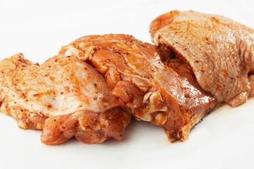 Free range Boneless chicken thighs on stone table. Raw chicken marinated thigh . The view from the Top. Food Background. Copy space. Cooking content. Meat shop.