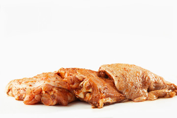 Free range Boneless chicken thighs on stone table. Raw chicken marinated thigh . The view from the Top. Food Background. Copy space. Cooking content. Meat shop.