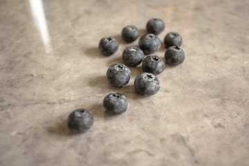 Scattered blueberries on counter