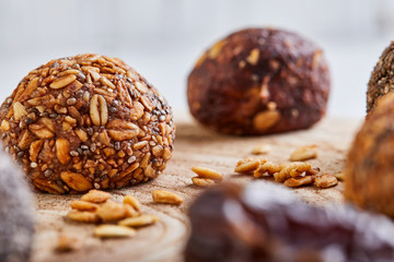Obraz na płótnie Canvas Healthy Organic Energy balls Muesli Bites with Nuts, Cocoa, Chia and Honey - Vegan Vegetarian Raw Snacks or Food. copy space. Close-up
