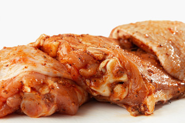 Free range Boneless chicken thighs on stone table. Raw chicken marinated thigh . The view from the Top. Food Background. Copy space. Cooking content. Meat shop.