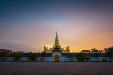 Fototapeta premium Thatluang is the most beautiful culture and icon of Vientiane Laos. Thatluang at sunset
