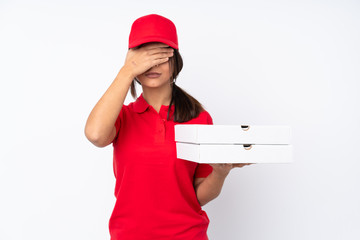 Young Pizza delivery girl over isolated white background covering eyes by hands. Do not want to see something